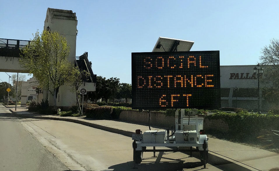 Lighted social distancing sign